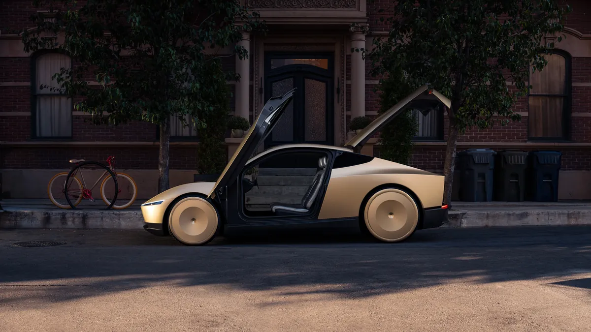 Tesla Cybercab portes ouvertes le long d’un trottoir résidentiel, un vélo appuyé contre un arbre au premier plan.