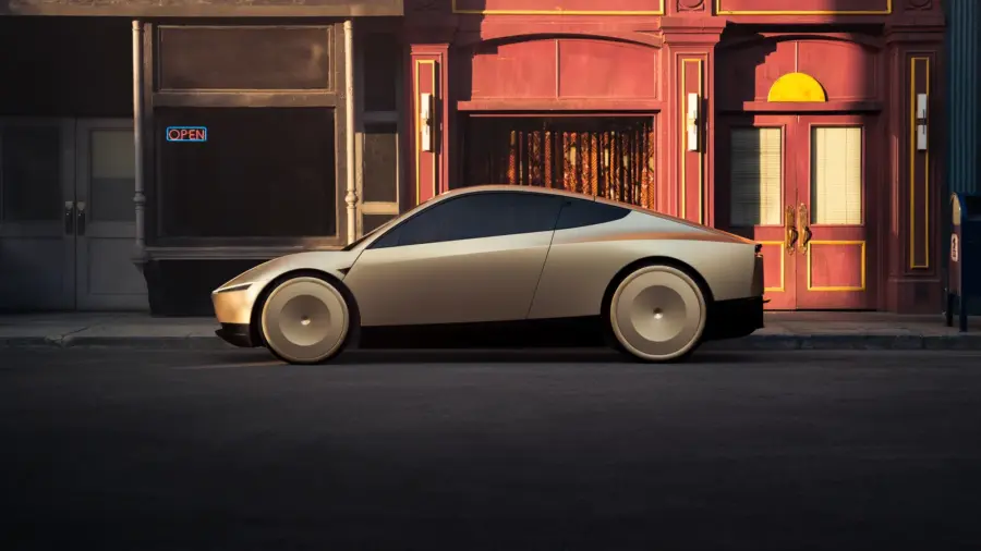 Profil d’un Tesla Cybercab devant une façade commerçante : aucun rétroviseur extérieur n’est visible.